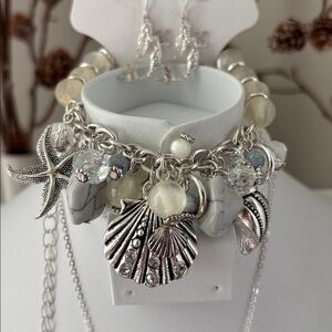 Laura Ford Seashells,Mermaid,Starfish, Silvertone earring & stretch bracelet set